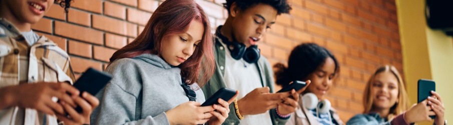 Children on phones scrolling on social media platforms